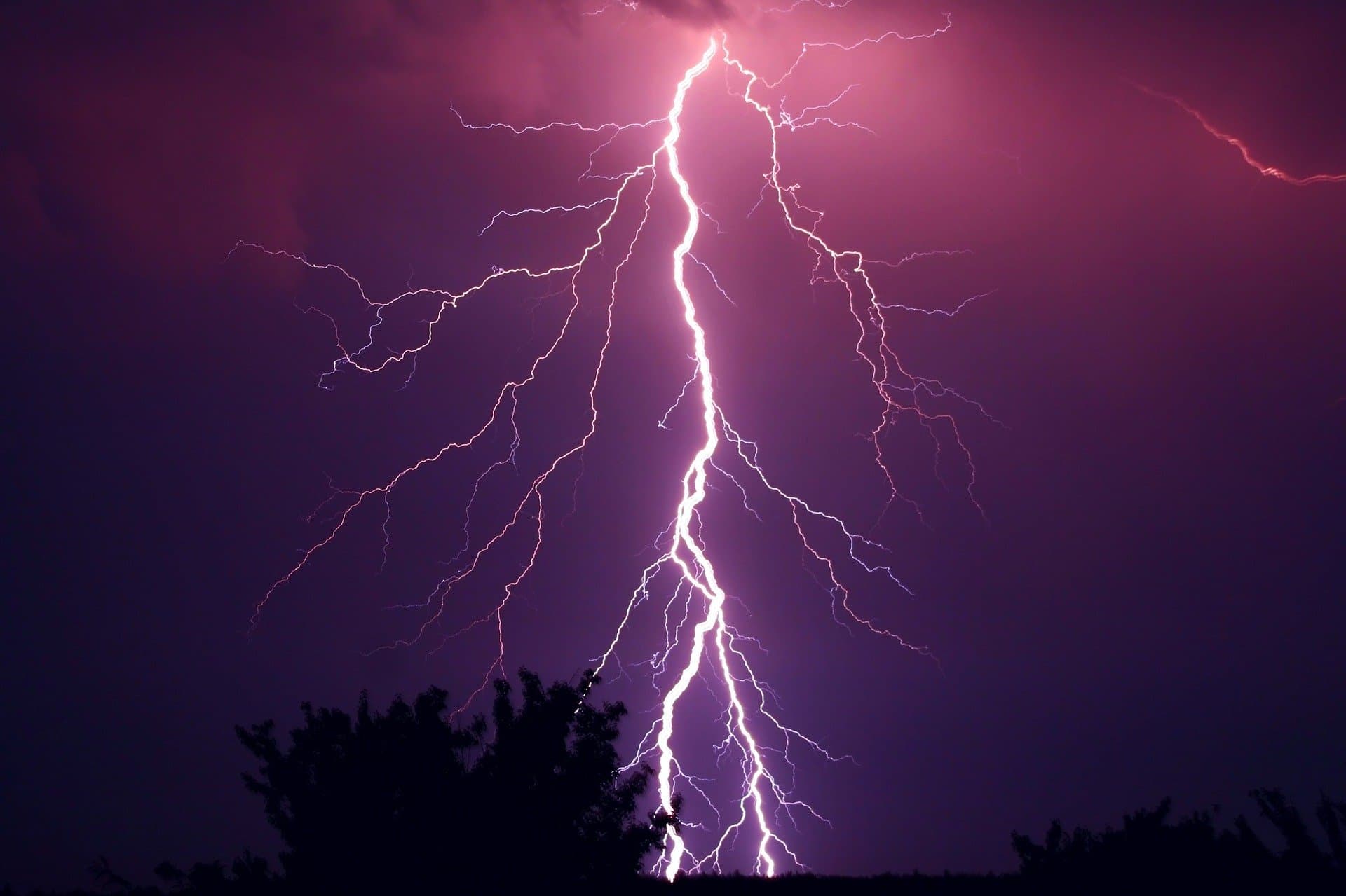 Surfer on a wave, thunderstorm, ancient library, code on the laptop screen